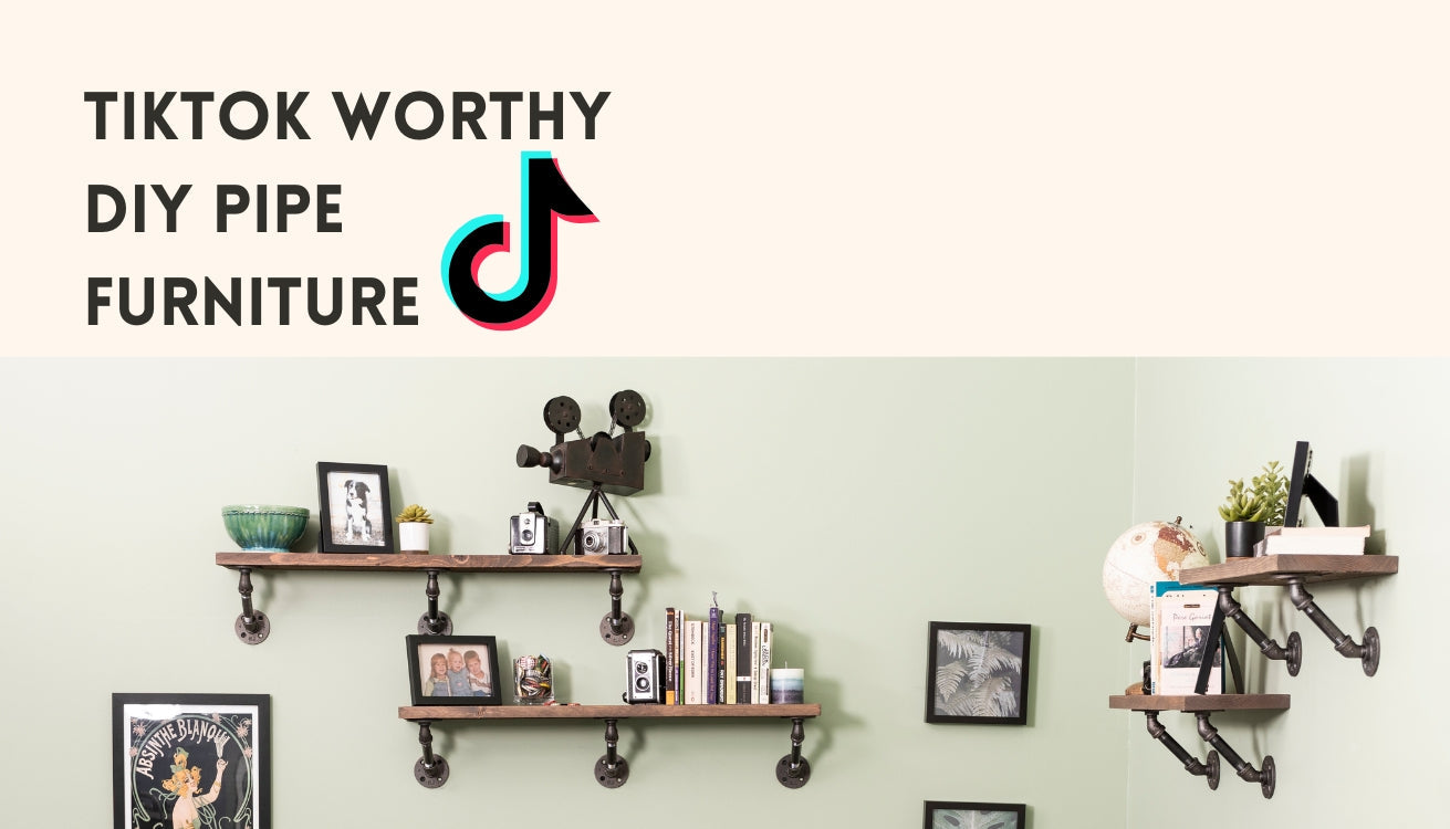 Pipe shelves stylishly decorated with pictures, books, and vintage cameras.