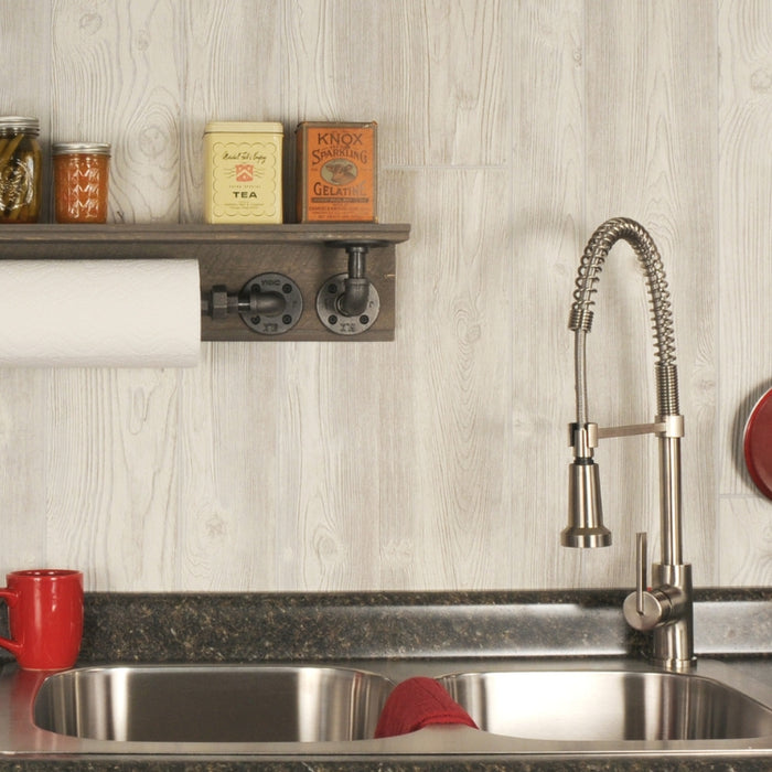 Innovative kitchen hacks featuring a PIPE DECOR® shelf and hooks holding kitchen essentials above a sink, blending functionality with industrial style.