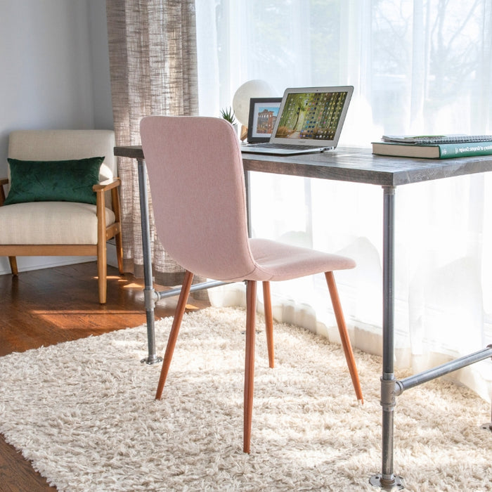 Bright and cozy home office featuring a minimalist industrial pipe desk, paired with a modern pink chair, perfect for productive work sessions.