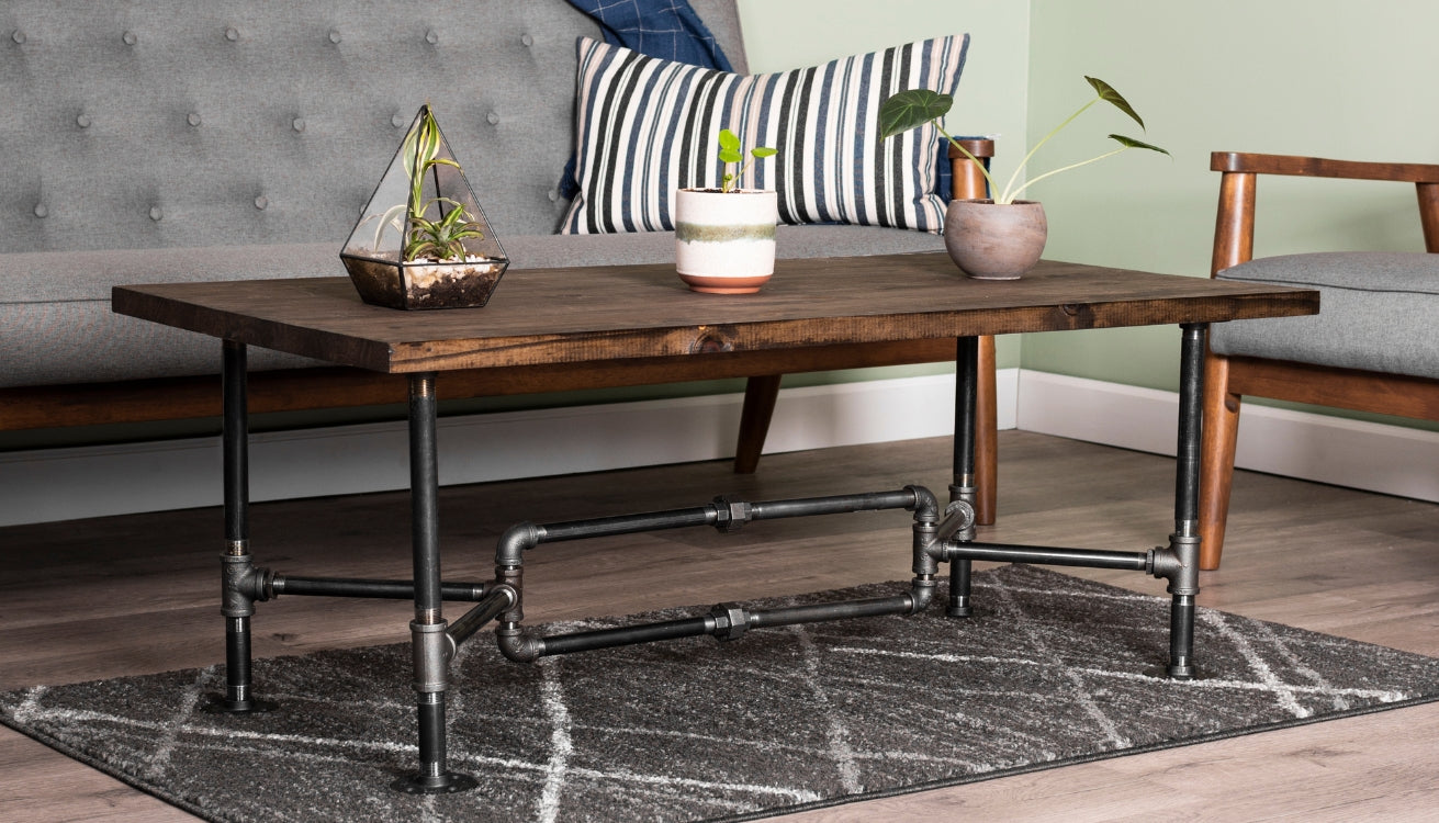 An image of a pipe coffee table in a living room setting.
