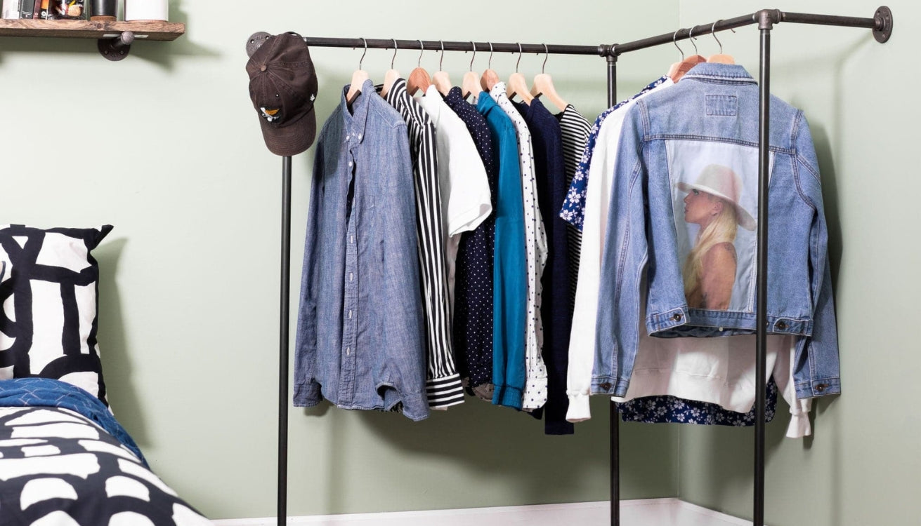 An open closet system built with industrial pipes and fittings.