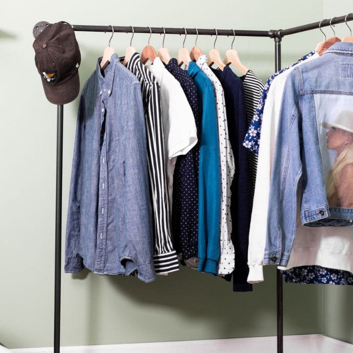 An open closet system built with industrial pipes and fittings. 