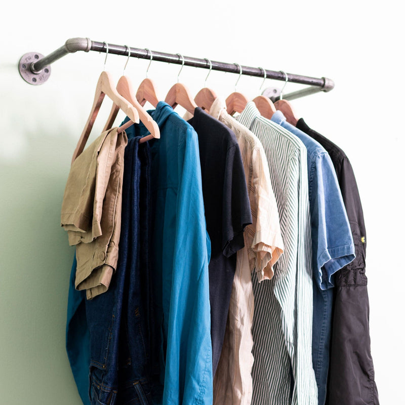 Image of pipe clothing rack hanging on wall