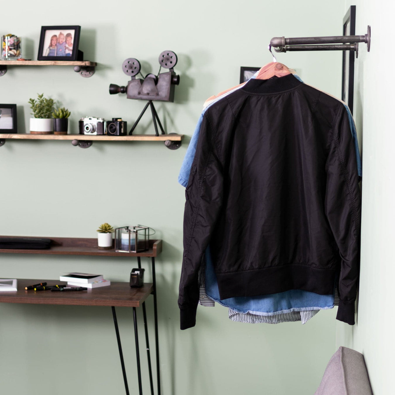 Image of pipe clothing rack hanging on wall