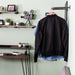 Image of pipe clothing rack hanging on wall